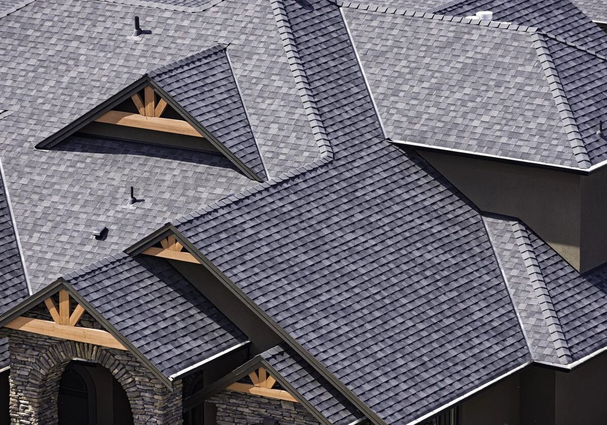 Gray asphalt shingled gabled house roof
