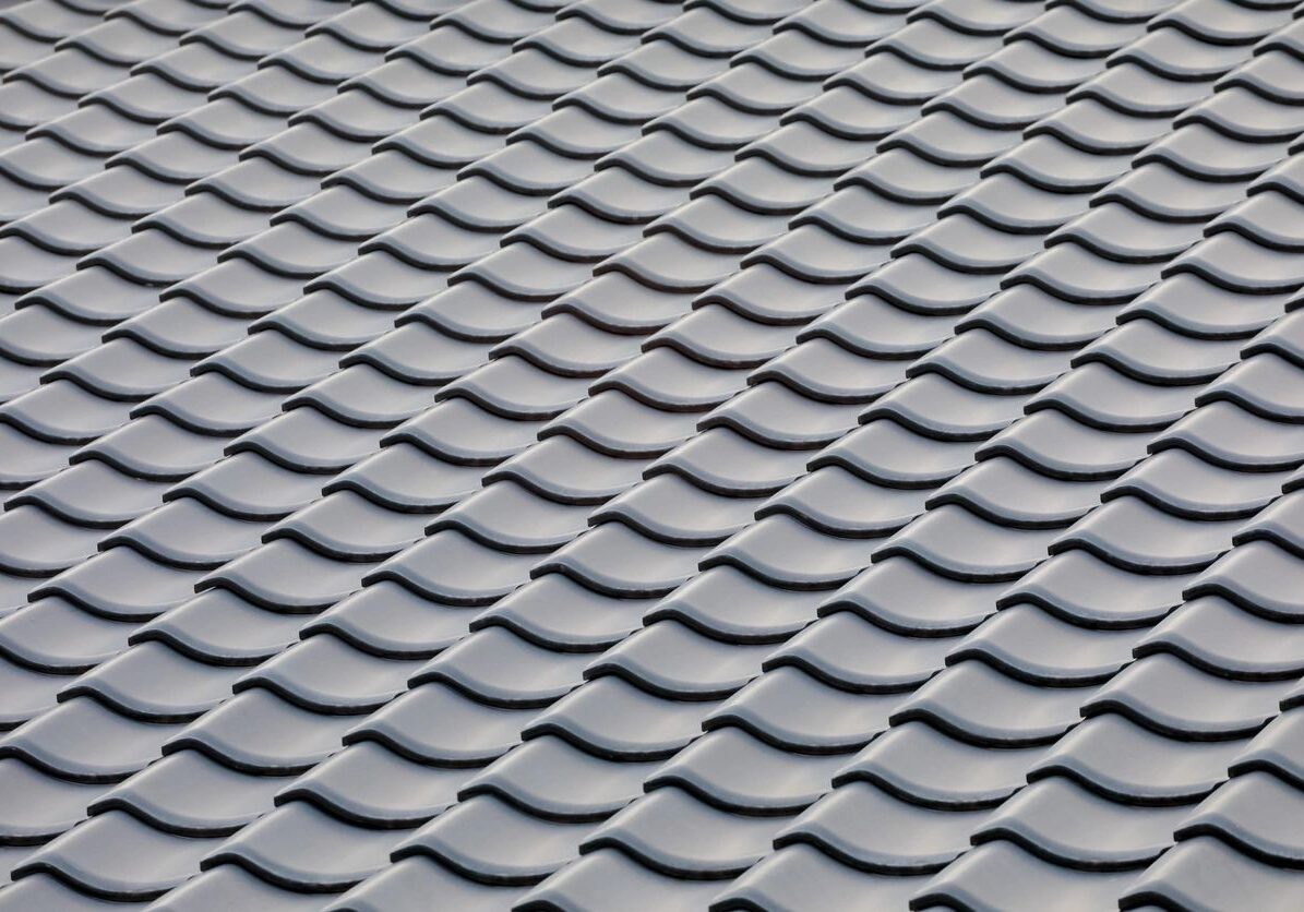 Close up of a roof with a lot of tiles, which are likely used for roofing