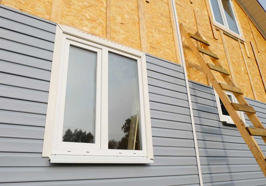 House under construction with a ladder leaning against the side of it